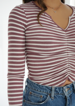 Close up front view of model wearing the Isabelle top in Maroon and white stripes