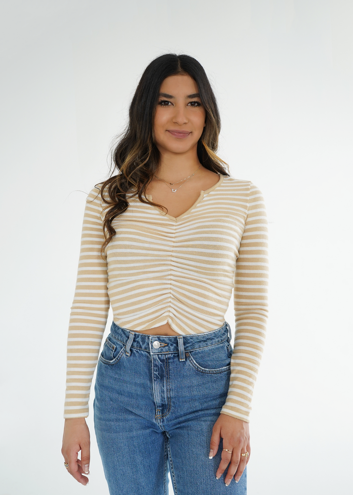 Front view of model wearing the Isabelle top in tan and white stripes