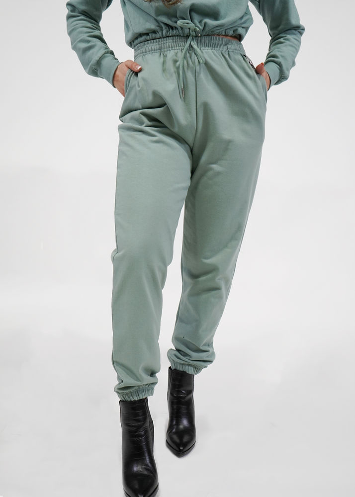 
                  
                    Front of model wearing jogger pant in butterfly sage green
                  
                