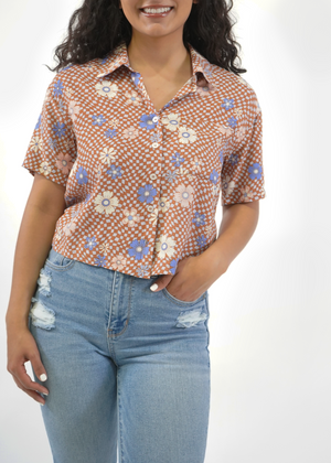 
                  
                    Front of model wearing James cropped shirt in groovy summer print
                  
                
