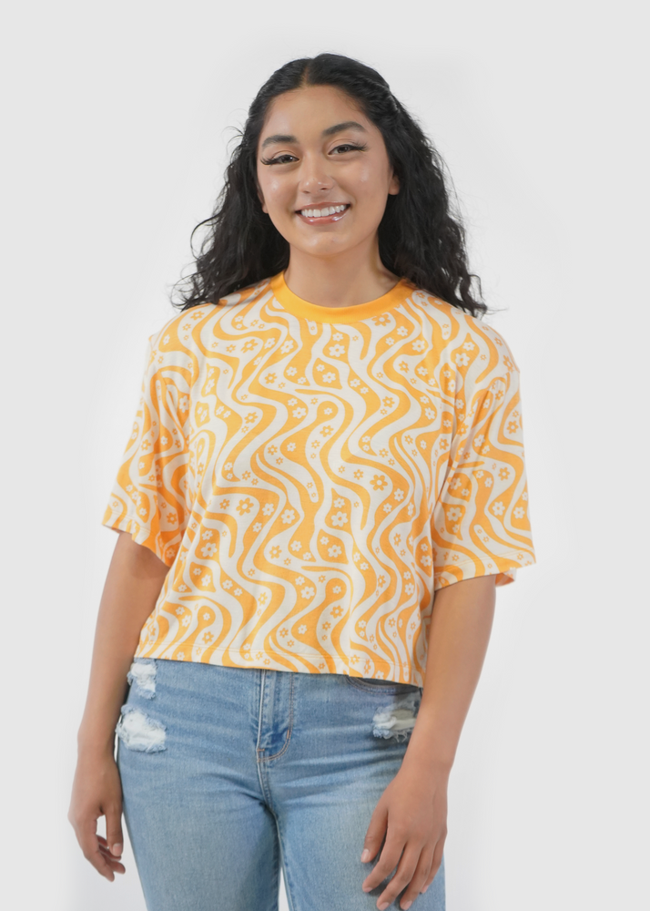Front of model wearing Allie Boxy Crop Tee in Marigold