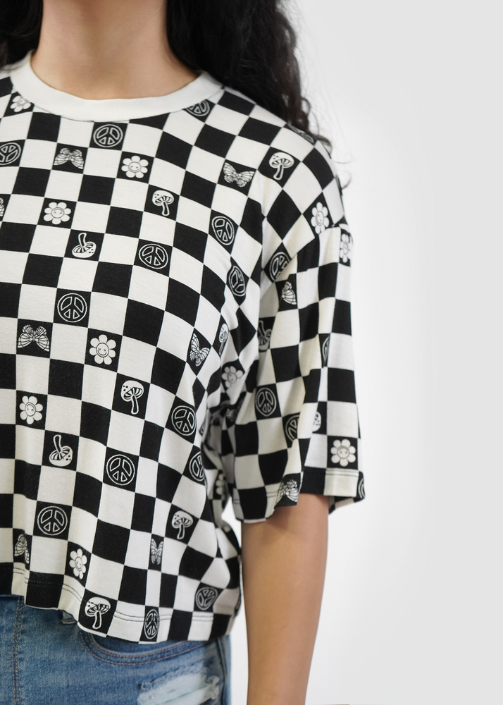 Close up of model wearing Allie tee in black checkerboard print