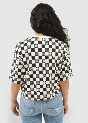 
                  
                    Back of model wearing Allie tee in black checkerboard print
                  
                