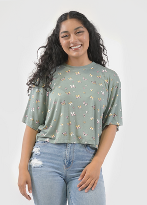 
                  
                    Front of model wearing Allie tee in Sage butterfly print
                  
                