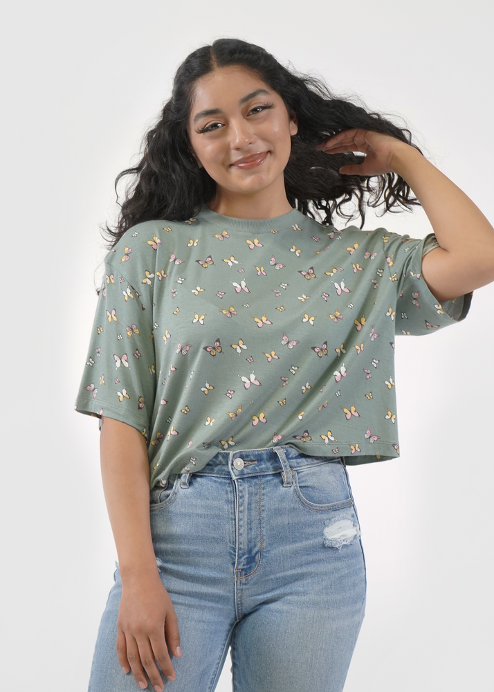 
                  
                    Front of model wearing Allie tee in Sage butterfly print
                  
                