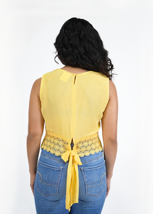 
                  
                    Back of model wearing Beverly crochet tank in canary yellow
                  
                