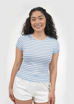 Front of model wearing Brandy tee in sky blue stripes