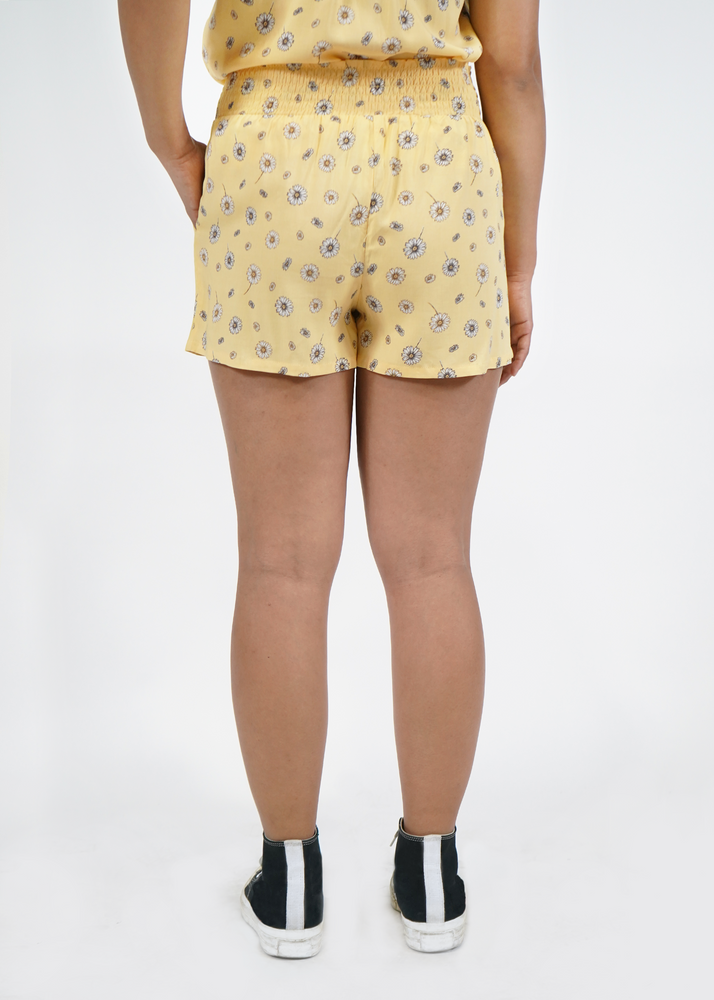 
                  
                    Back view of model wearing Malibu shorts in Sunshine yellow print
                  
                