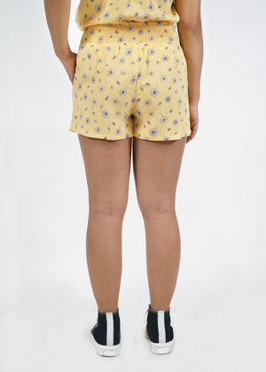 
                  
                    Back view of model wearing Malibu shorts in Sunshine yellow print
                  
                