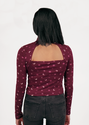 
                  
                    Back of mock neck revealing cut out at the top of the garment
                  
                