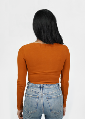 
                  
                    Back of model wearing 2x1 ribbed knit bodysuit with square neck at front and round neck at back
                  
                