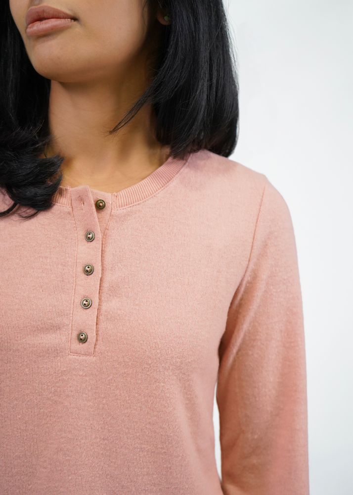 
                  
                    close up of buttons on center front of henley
                  
                