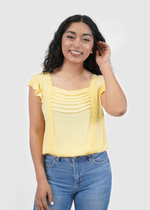 Front of model wearing Amy ruffle sleeve smocked top in luna yellow