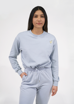 Front of model wearing Aspen sweatshirt in zen blue